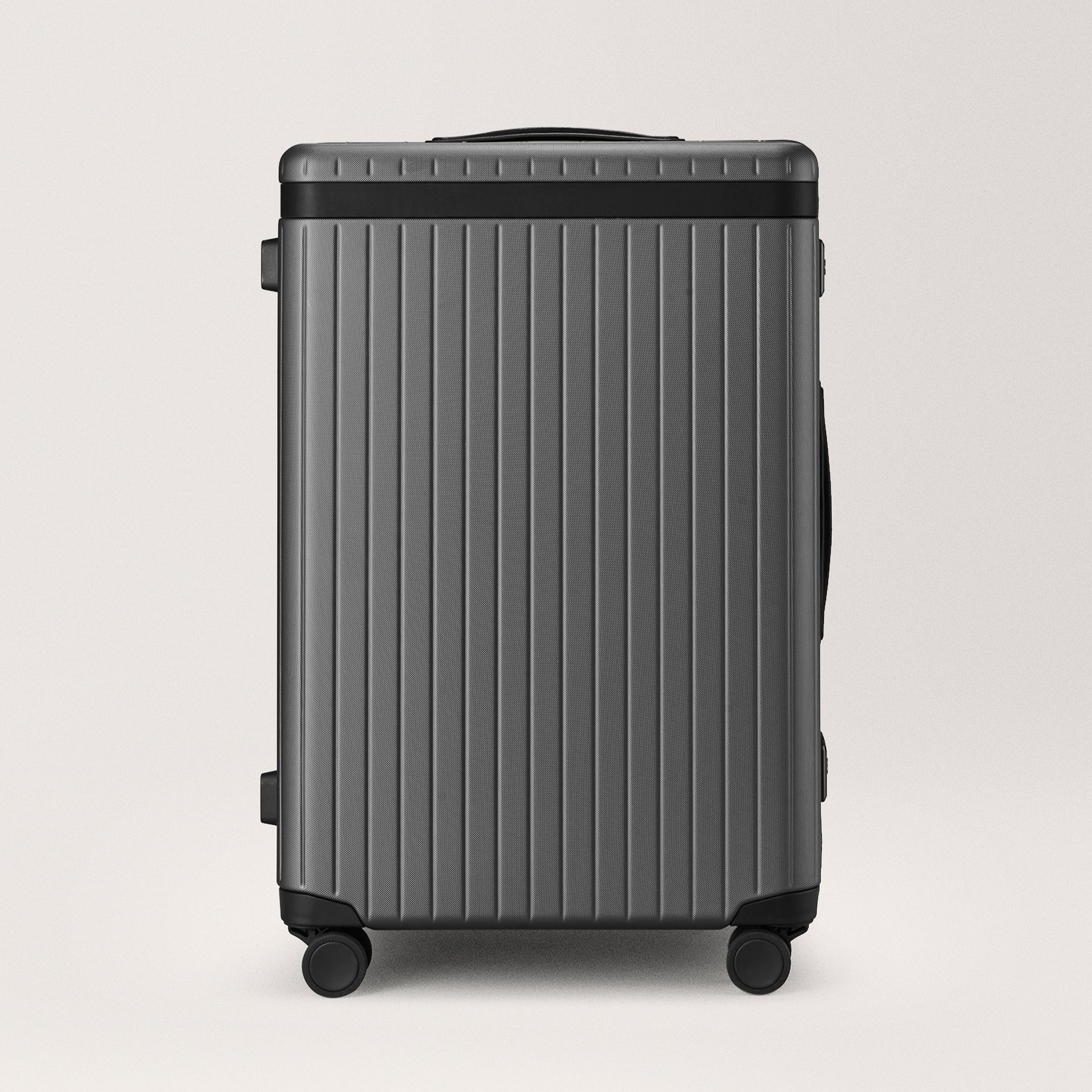 The Check-in - Discontinued Grey / Black / Dotted Hard-shell check-in suitcase